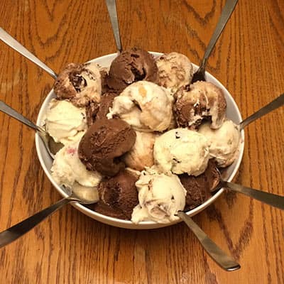 Huge bowl of Ben & Jerry's Ice Cream with several spoons